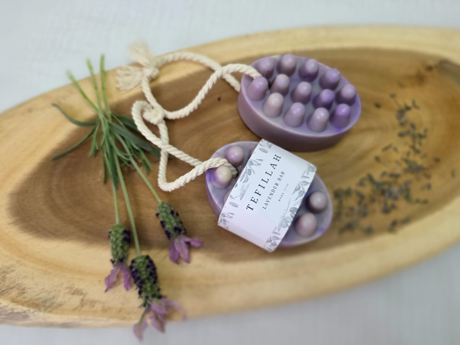 Homemade lavender soap on a rope with purple mica swirls, handcrafted by Tefillah Handmade Products