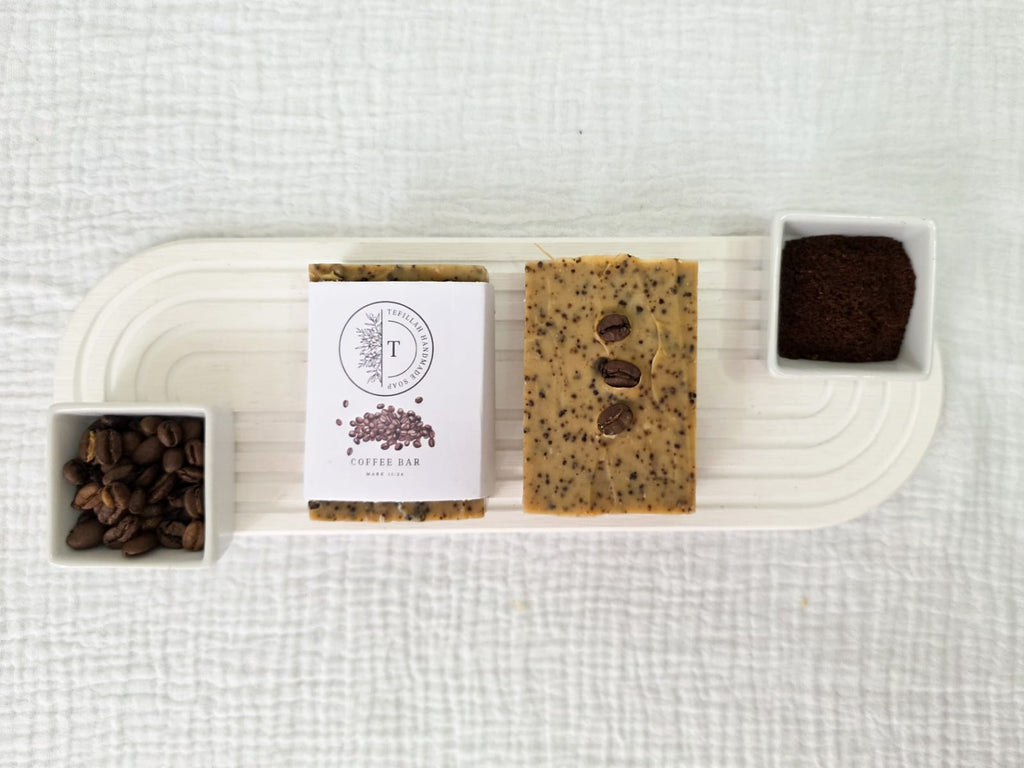 Close-up of Tefillah coffee soap bar showing coffee ground texture, made with filter coffee, coffee grounds and shea butter