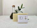 Handmade unscented soap bar on a natural surface, gentle for sensitive and eczema-prone skin