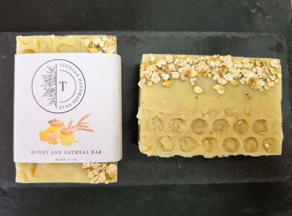 Close-up of Tefillah honey and oatmeal soap bar showing natural oatmeal texture, made with colloidal oatmeal, honey and shea butter