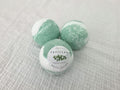Handmade eucalyptus bath bomb by Tefillah Handmade Products, infused with coconut oil and eucalyptus essential oil to relieve congestion, soothe sore muscles, and ease headaches