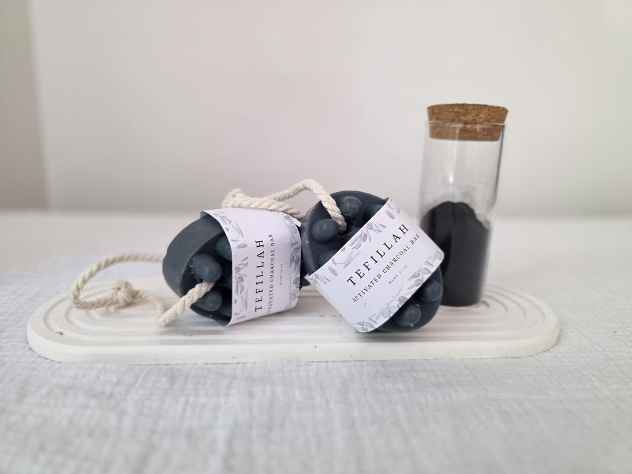 Homemade Activated Charcoal Soap on a Rope by Tefillah Handmade Products — natural black soap bar with tea tree and lavender essential oils, hung on a rope