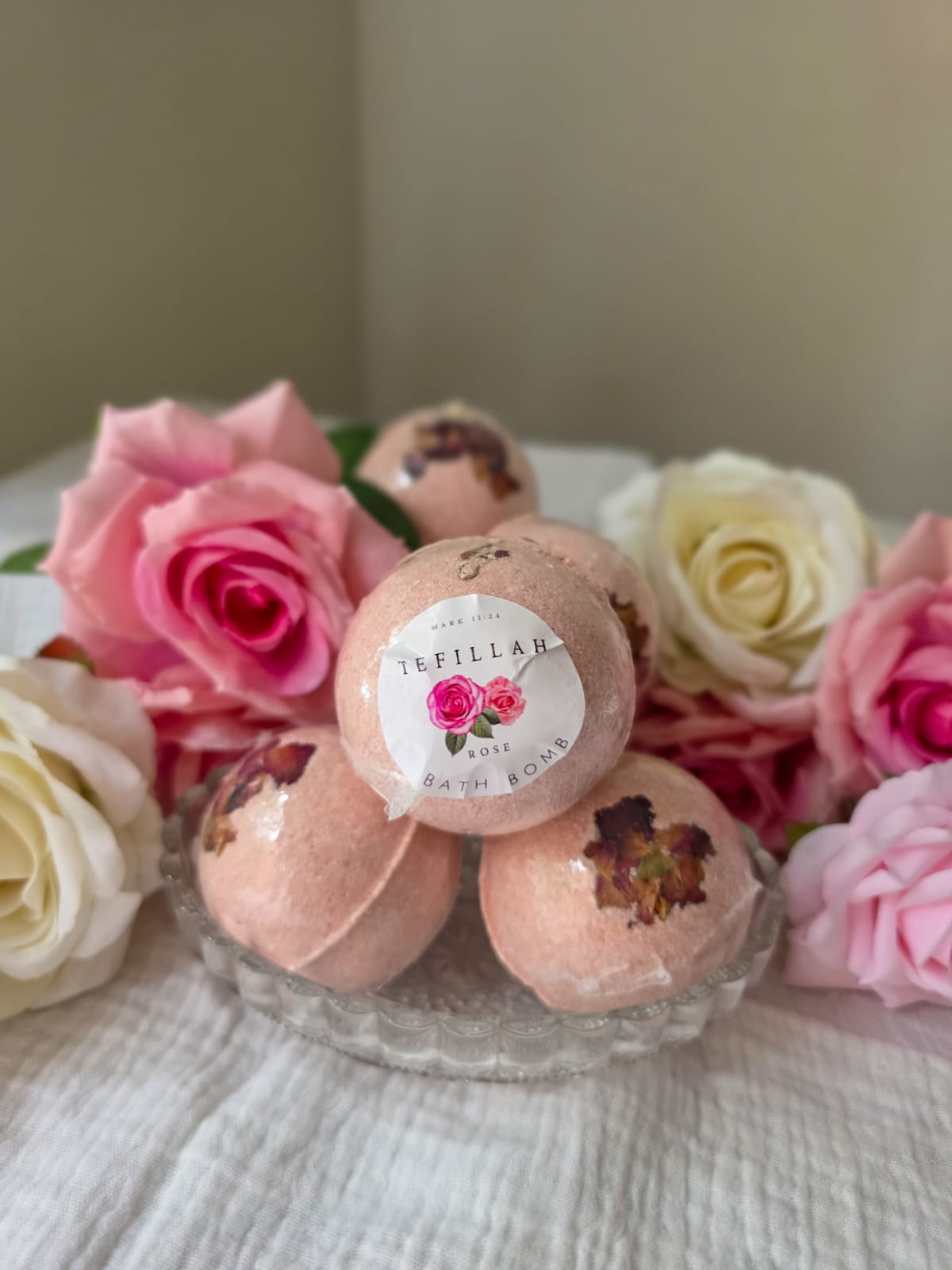 Handmade rose bath bomb by Tefillah Handmade Products, infused with coconut oil and rose fragrance oil for a luxurious, mood-lifting bath experience