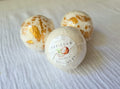 Handmade coconut bath bomb by Tefillah Handmade Products, with shimmer mica powder and coconut fragrance oil for a sparkling, tropical bath experience
