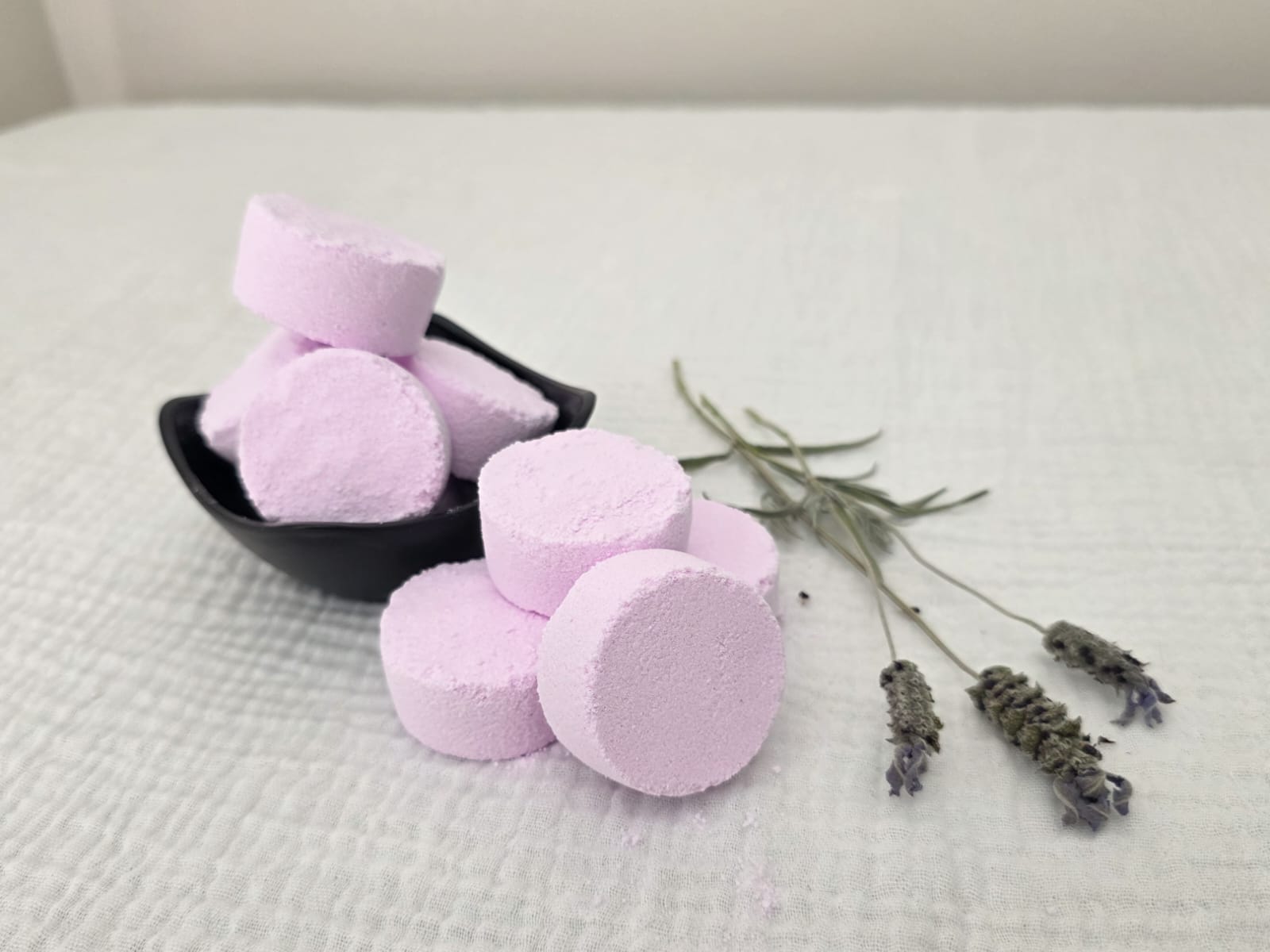 Lavender shower steamer dissolving in shower for relaxation and calm