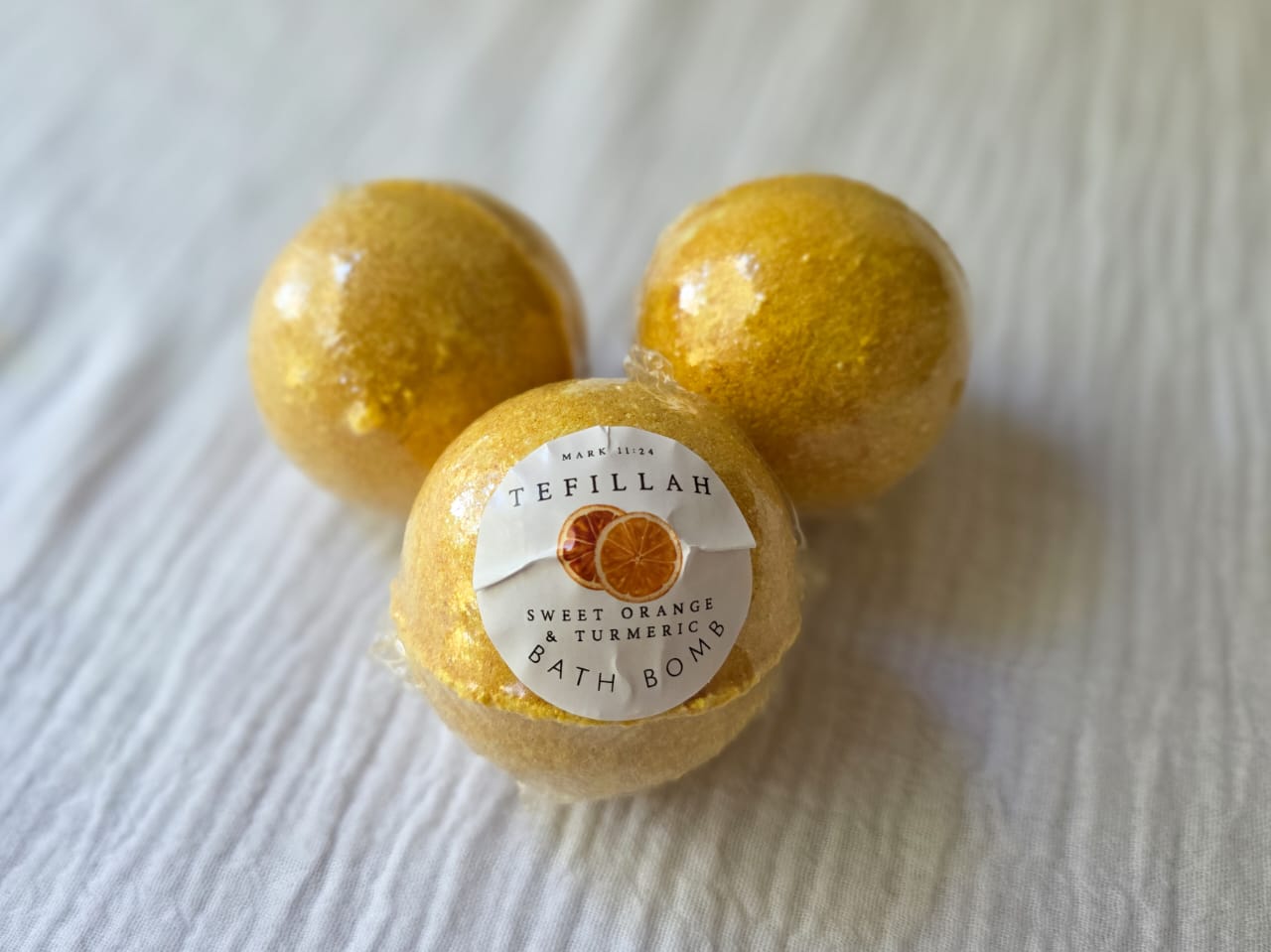 Homemade Turmeric & Sweet Orange Bath Bomb by Tefillah Handmade Products — golden, skin-brightening bath bomb with warm earthy and citrus scent