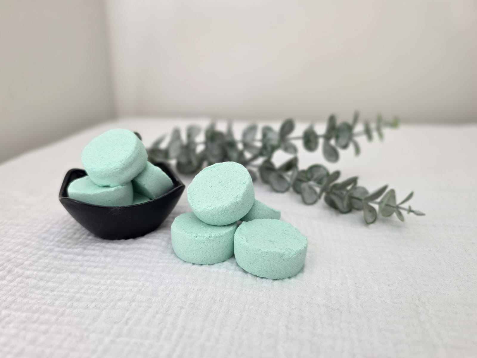 Eucalyptus and menthol shower steamer fizzing in shower for sinus relief
